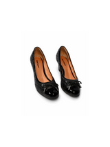 Patent cap toe and bow detail — black quilted Hush Puppies block-heel pumps | SO. by Sora