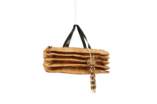 Compressed beige bag