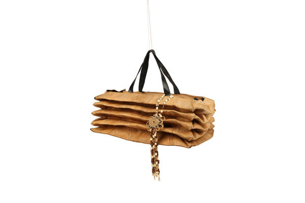 Compressed beige bag